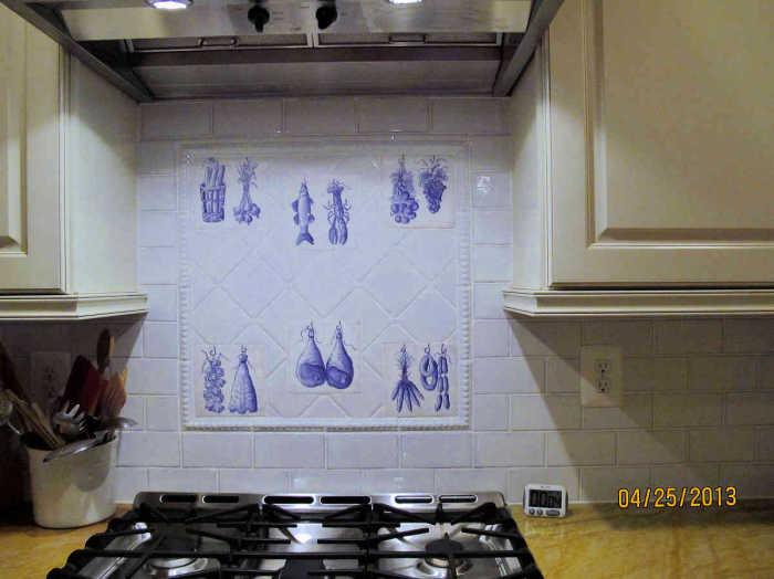 Angelas Azulejo Accent Tiles. Nicely installed as vignettes over the kitchen stove.