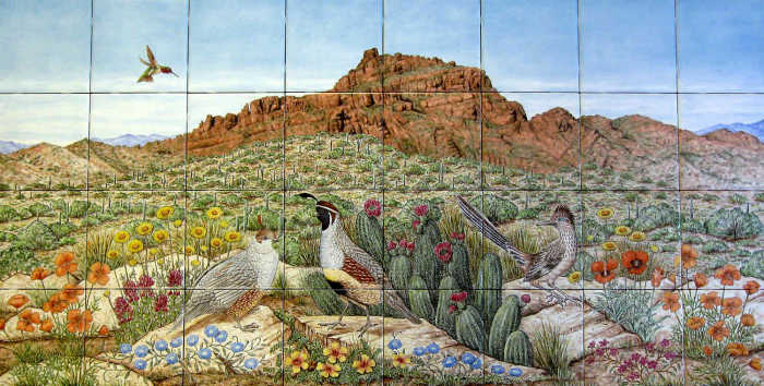 Distinct Red Mountain desert scenery in Phoenix, Arizona area. Mountain in background, native wildflowers, quail, roadrunner in foreground. Painted tile mural by Julia Sweda.