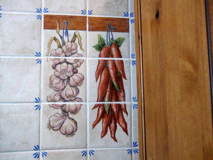 European Style Country Kitchen cuisine spices. Freshly picked hanging garlic and paprika vignette.