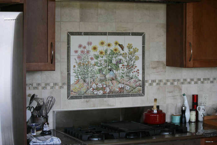 Pools Idaho Wildflowers tile mural. Installed as backsplash with decorative border tiles.