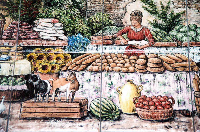 Provence Street Market backsplash tile mural. Woman selling baguettes, fresh breads. Artist Julia Sweda.