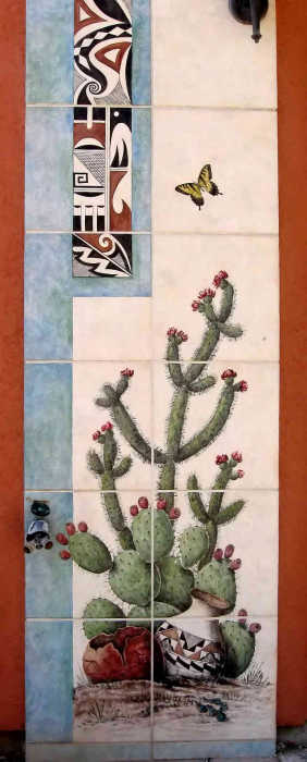 Santa Fe Style Home Exterior Tile Art. Flowering Engelmann Prickly Pear and cholla cactus with Pueblo Indian tribal pottery artifacts. Painted tile art by Julia Sweda.