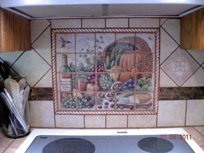 Diannes Sparkling Cider Harvest Basket kitchen tile mural installed in the kitchen as a backsplash. Artist Julia Sweda.